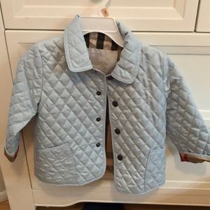 Girl’s Burberry coat.